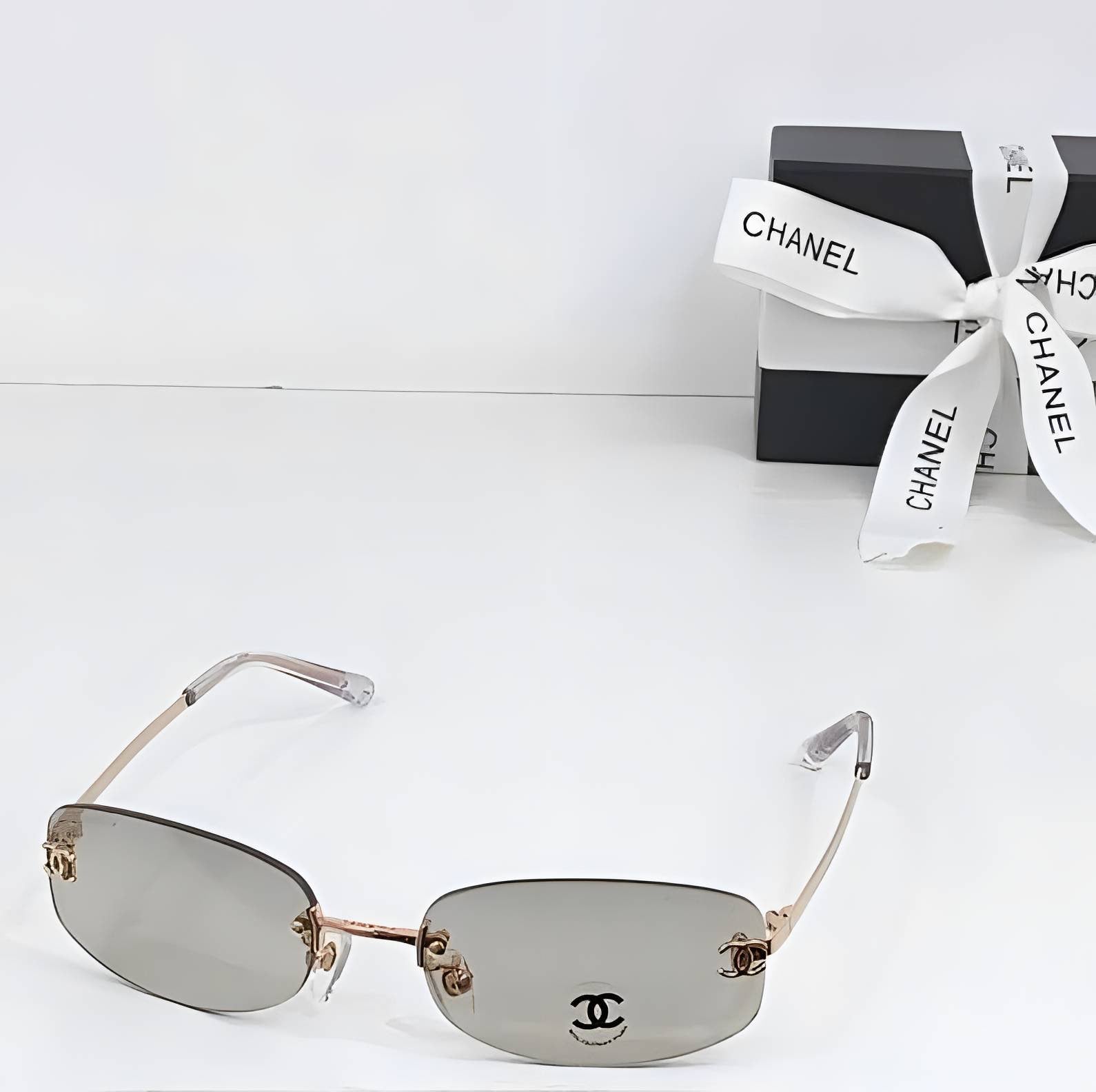 Chnel Glass - Rimless Rose Gold Smoke Lens